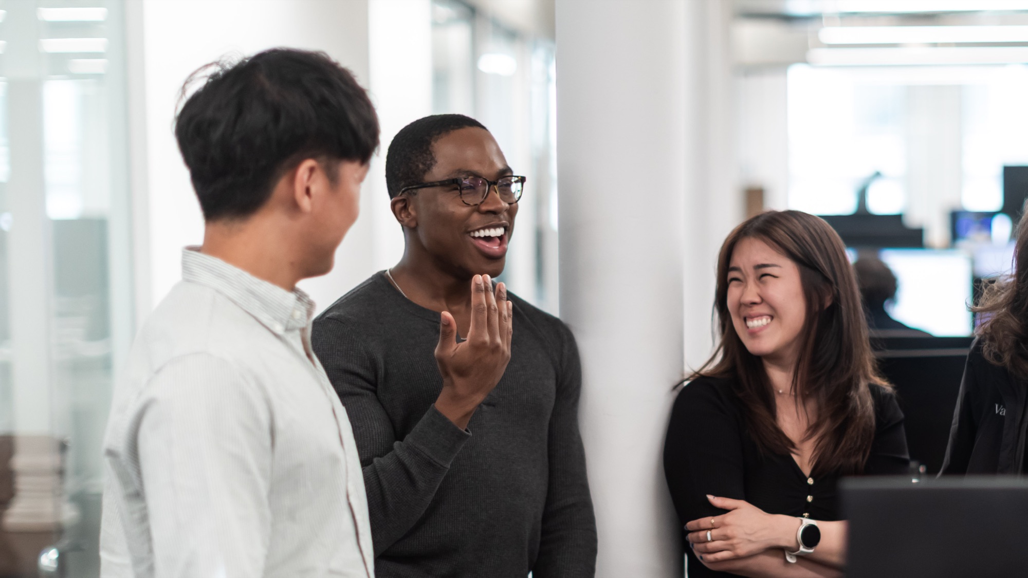 Valon teammates sharing a laugh in the office