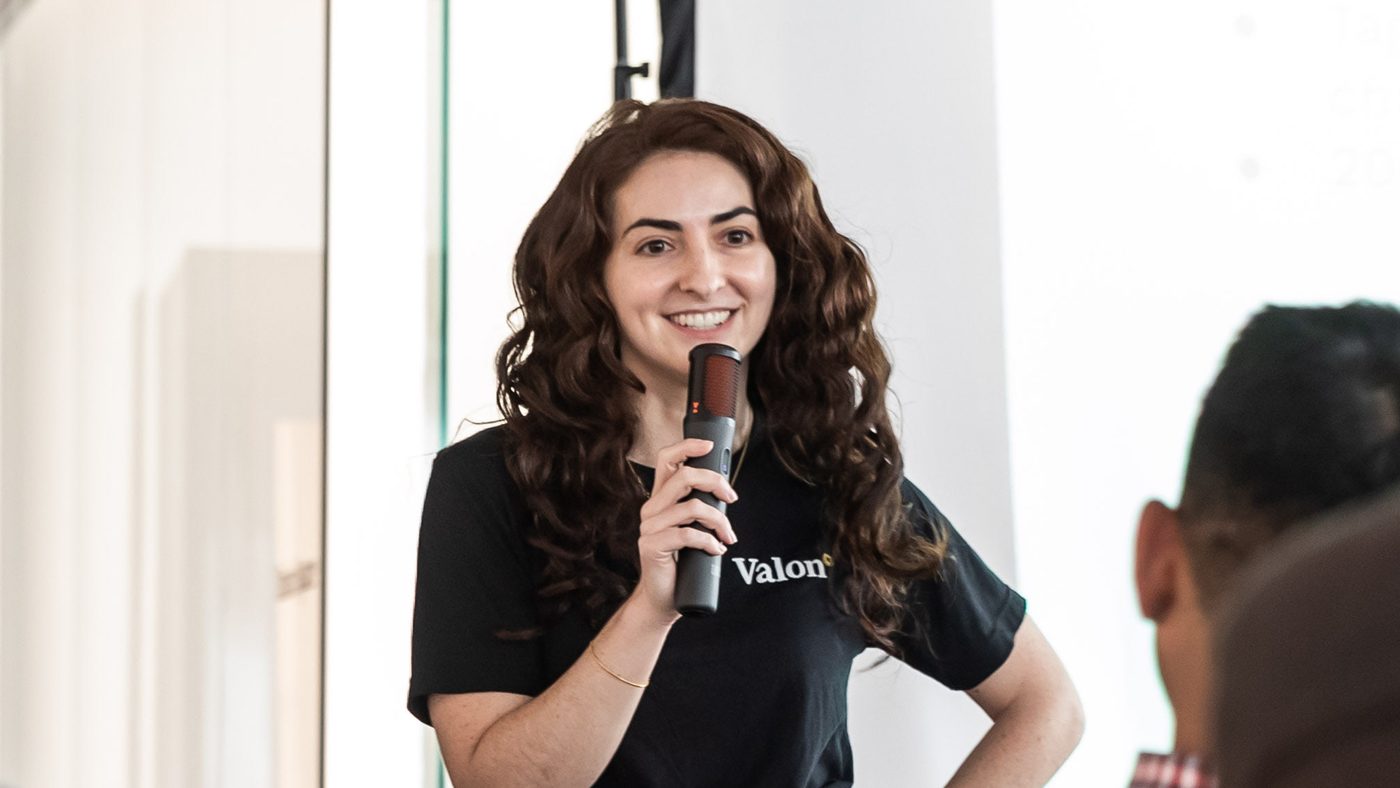 A Valon teammate speaking at a company event