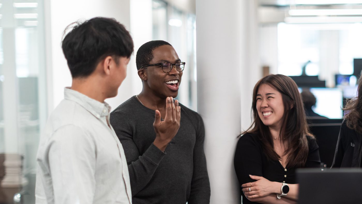 Valon colleagues sharing a laugh in the office